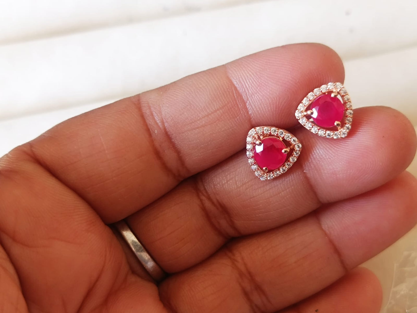 That sounds like a beautiful and poetic way to describe Trinagle-shaped earrings with a desi touch